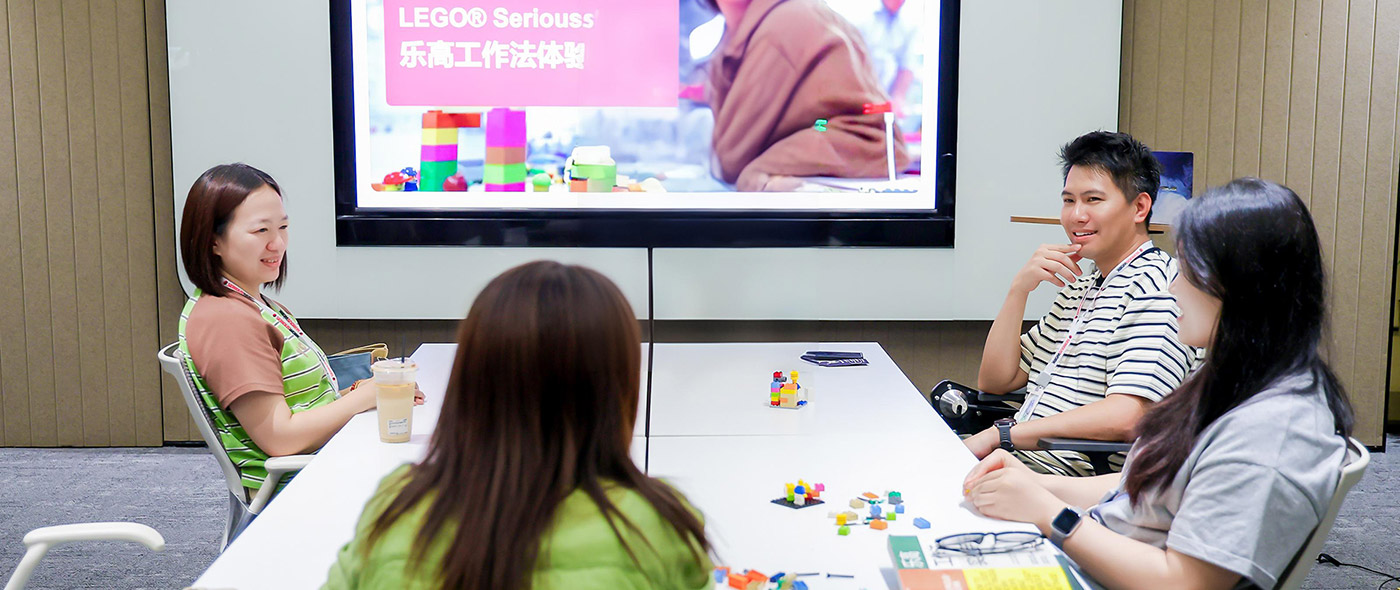 Lady smiling in class at male student